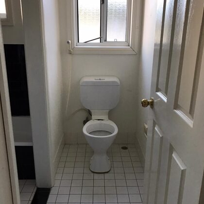 Exist Photo of detached toilet from bathroom 
